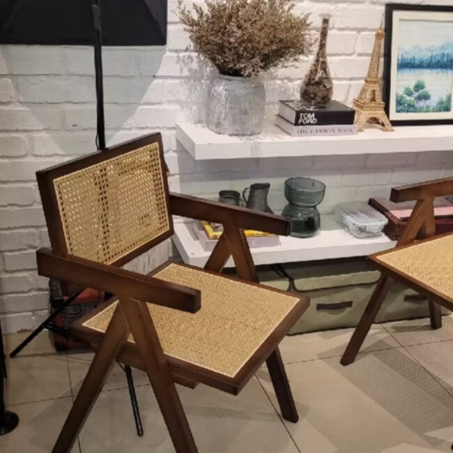 Teak wood Dining chair made from teak wood and rattan, placed in a living room. Samz Design home of custom furniture Malaysia