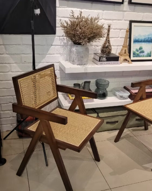 Teak wood Dining chair made from teak wood and rattan, placed in a living room. Samz Design home of custom furniture Malaysia