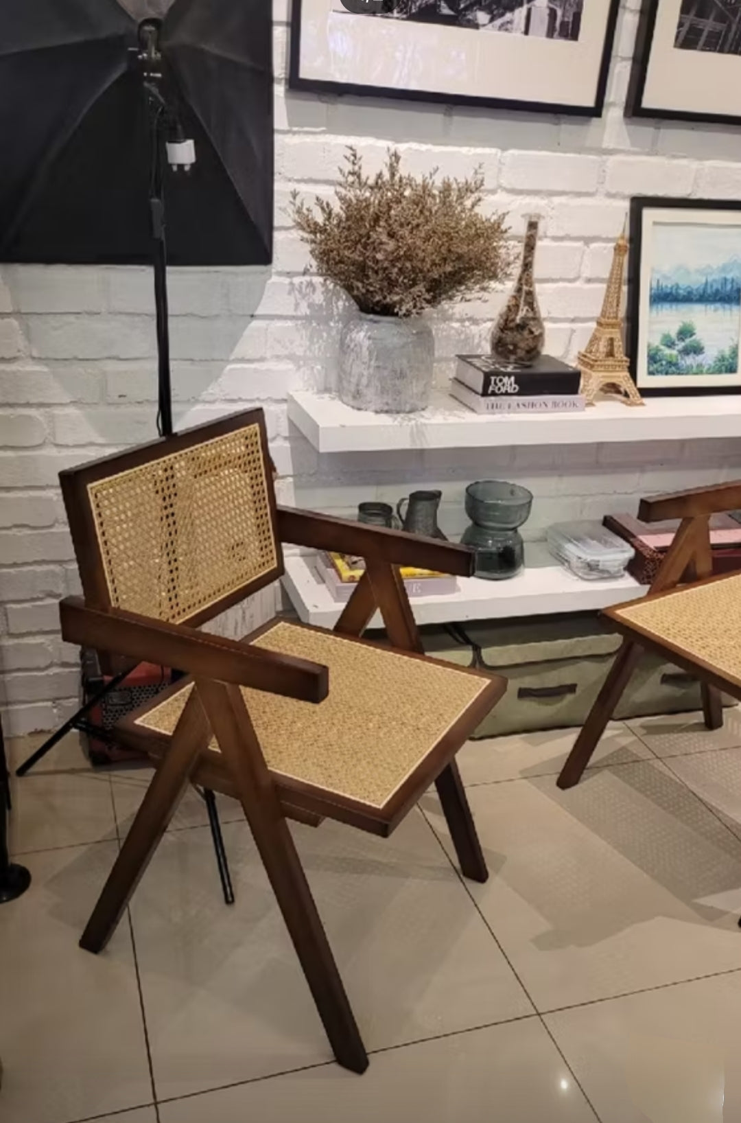 Teak wood Dining chair made from teak wood and rattan, placed in a living room. Samz Design home of custom furniture Malaysia