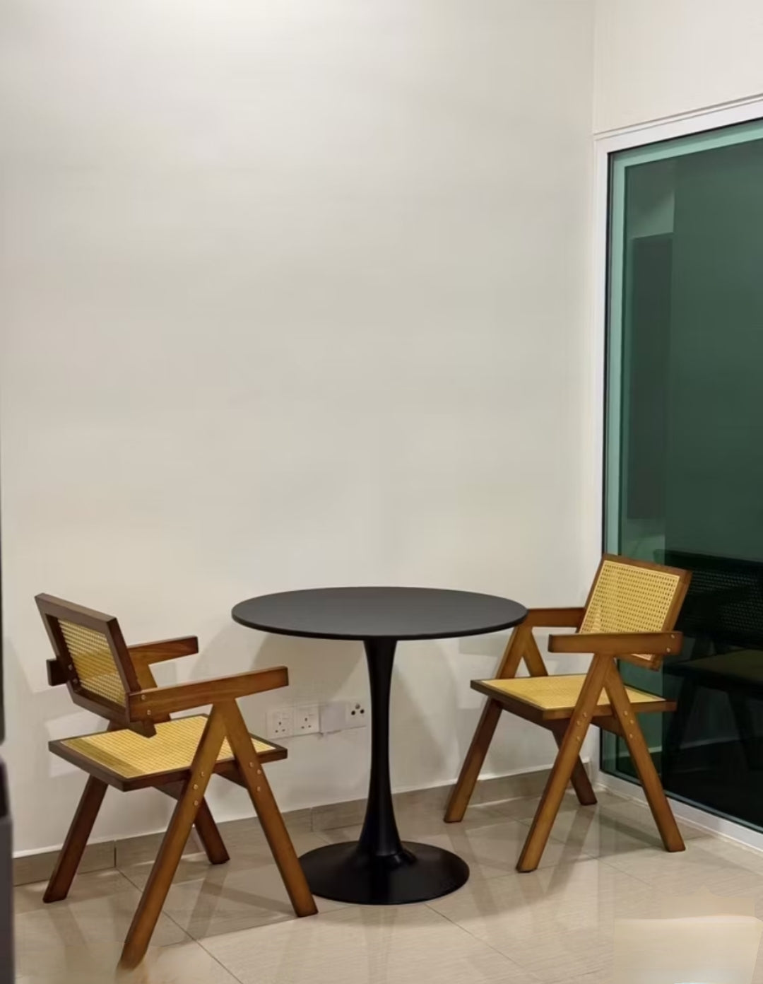 solid wood Dining chair made from teak wood and rattan, placed in a room. Samz Design home of custom furniture Malaysia. Two chairs with dining table.